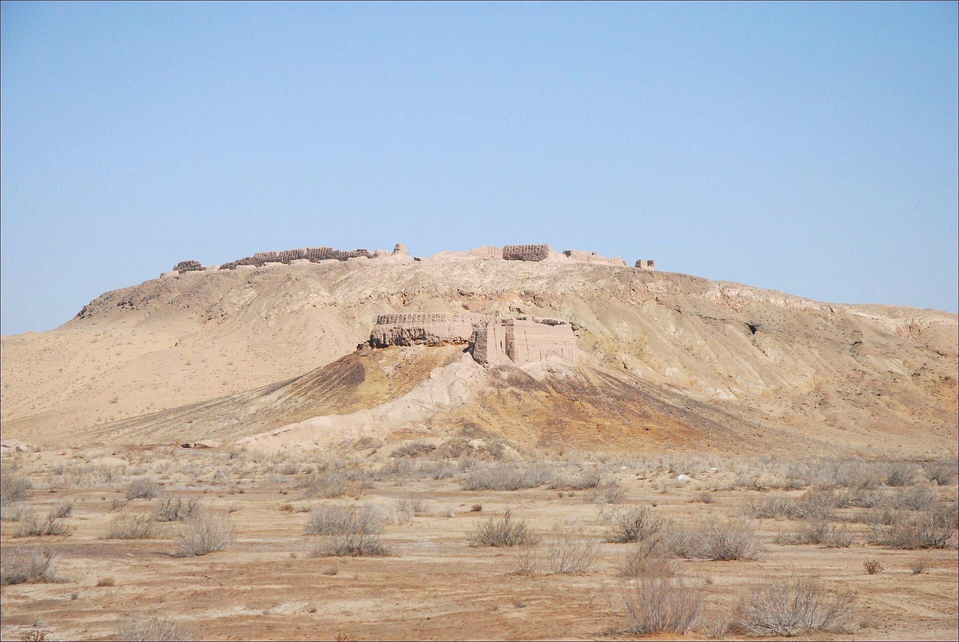 The mud-brick walls of the Ayaz-Kala fortress on a ridge above the Kyzylkum desert